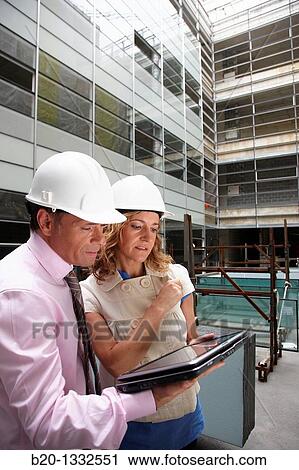 Architect and client with tablet PC in construction site View Large Photo Image Stock Image - Architect and client with tablet PC in construction site. Fotosearch