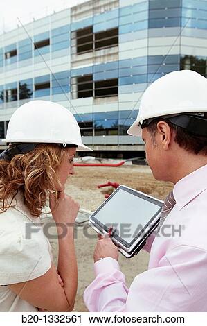 Architect and client with tablet PC in construction site View Large Photo Image Stock Image - Architect and client with tablet PC in construction site. Fotosearch