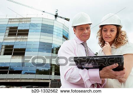 Architect and client with tablet PC in construction site View Large Photo Image Stock Image - Architect and client with tablet PC in construction site. Fotosearch