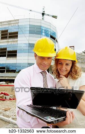 Architect and client with tablet PC in construction site View Large Photo Image Stock Image - Architect and client with tablet PC in construction site. Fotosearch