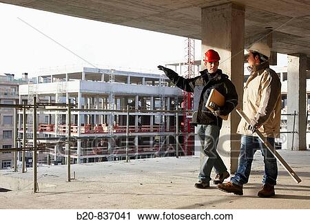 Architect and construction worker, personal protective equipment, housing construction, concrete skeleton View Large Photo Image Stock Image - Architect and construction worker, personal protective equipment, housing construction, concrete skeleton. Fotosearch