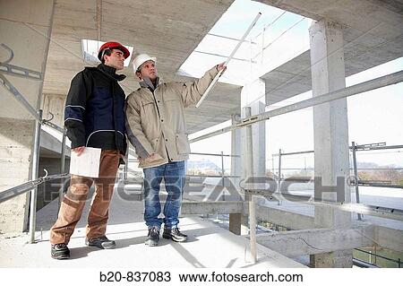 Architect and construction worker, personal protective equipment, housing construction, concrete skeleton View Large Photo Image Stock Image - Architect and construction worker, personal protective equipment, housing construction, concrete skeleton. Fotosearch