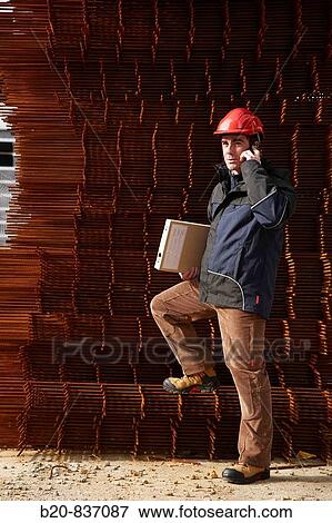 Architect, corrugated iron for formwork, housing construction View Large Photo Image Stock Photo - Architect, corrugated iron for formwork, housing construction. Fotosearch