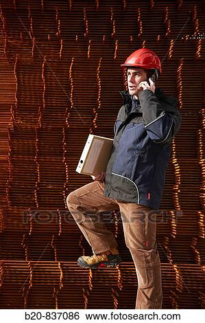 Architect, corrugated iron for formwork, housing construction View Large Photo Image Stock Photograph - Architect, corrugated iron for formwork, housing construction. Fotosearch