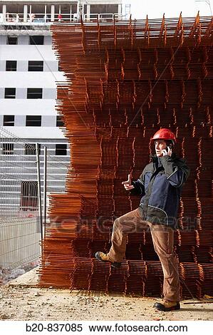 Architect, corrugated iron for formwork, housing construction View Large Photo Image Stock Photography - Architect, corrugated iron for formwork, housing construction. Fotosearch