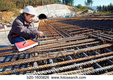 Architect overseeing the installation of rebar, reinforcing steel bars for concrete formwork, Construction of viaduct, Works of the new railway platform in the Basque Country, High-speed train? Basque Y? View Large Photo Image Stock Photograph - Architect overseeing the installation of rebar, reinforcing steel bars for concrete formwork, Construction of viaduct, Works of the new railway platform in the Basque Country, High-speed train? Basque Y?. Fotosearch