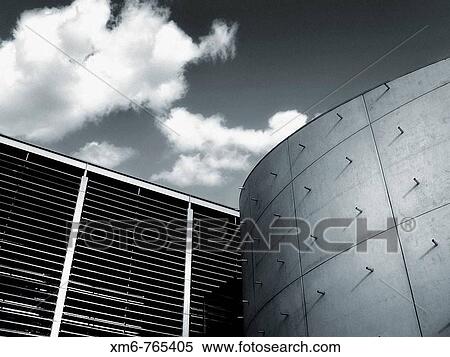 Architectural detail of the building where i straight curves converge on a background of sky with clouds. Photographs in black and white turned blue with soft View Large Photo Image Stock Photography - Architectural detail of the building where i straight curves converge on a background of sky with clouds. Photographs in black and white turned blue with soft. Fotosearch