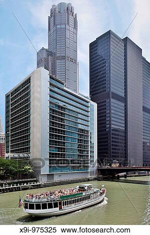 Stock Photography - Architectural tour boat traveling down Chicago River. Fotosearch