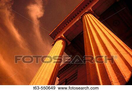 Architecture of two columns on building looking up at sky and clouds View Large Photo Image Stock Photo - Architecture of two columns on building looking up at sky and clouds. Fotosearch