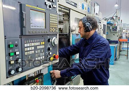 Stock Photograph - Area automated CNC lathes. Machined Indecober. Machining of precision parts in series. Automotive industry. Berriz. Bizkaia. Basque Country. Spain.. Fotosearch