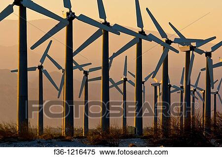 Array of Clean Energy Power generating windmills at wind farm at sunrise, Palm Springs, Riverside County, California View Large Photo Image Stock Photography - Array of Clean Energy Power generating windmills at wind farm at sunrise, Palm Springs, Riverside County, California. Fotosearch