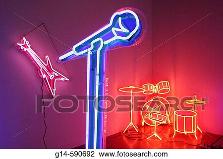 Stock Image - Art Basel, galleries, dealers, buyers, collectors, neon, microphone, drums. Convention Center. Miami Beach. Florida. USA.. Fotosearch