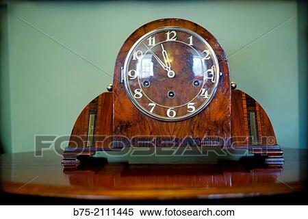 Art Deco, vintage clock on a table in a house in England, UK, Europe. View Large Photo Image Stock Photography - Art Deco, vintage clock on a table in a house in England, UK, Europe.. Fotosearch