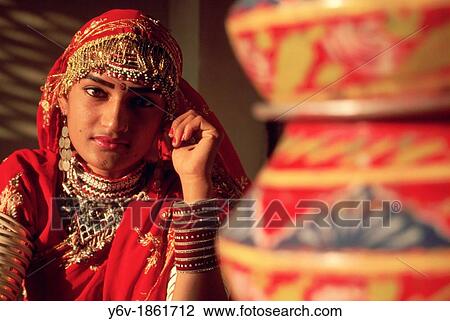 Artist traditionally dressed posing with earthen pots. Rajasthan, India. View Large Photo Image Stock Image - Artist traditionally dressed posing with earthen pots. Rajasthan, India.. Fotosearch