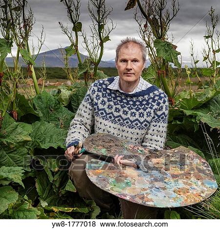 Artist with palette, surrounded by rhubarb plants, Borgarfjordur, Iceland View Large Photo Image Stock Photo - Artist with palette, surrounded by rhubarb plants, Borgarfjordur, Iceland. Fotosearch