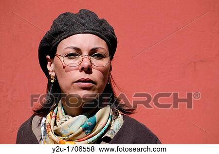 Artist woman with hat and eyeglasses on red background View Large Photo Image Stock Photo - Artist woman with hat and eyeglasses on red background. Fotosearch
