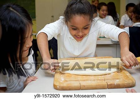 As part of National Food Day, second and third graders participate in a Plant Part Pizza cooking session at Columbia University's Teachers College in New York View Large Photo Image Stock Image - As part of National Food Day, second and third graders participate in a Plant Part Pizza cooking session at Columbia University's Teachers College in New York. Fotosearch