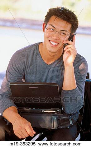 Asain man on cell phone View Large Photo Image Stock Photography - Asain man on cell phone. Fotosearch