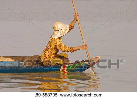 Asia, Cambodia, Lake Tonle Sap. Woman in to a small Fishing boat View Large Photo Image Stock Photography - Asia, Cambodia, Lake Tonle Sap. Woman in to a small Fishing boat. Fotosearch