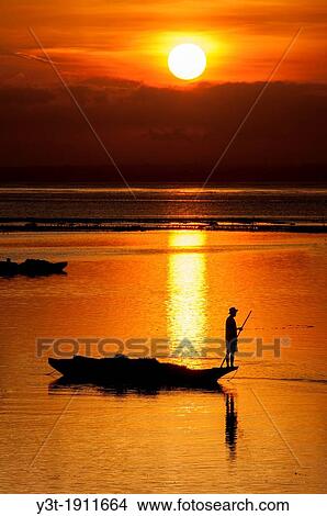 Asia, South-East Asia, Indonesia, Bali. Nusa Lembongan island. Seaweeds harvest. Boat Returning In The Evening After Harvesting Seaweeds. View Large Photo Image Picture - Asia, South-East Asia, Indonesia, Bali. Nusa Lembongan island. Seaweeds harvest. Boat Returning In The Evening After Harvesting Seaweeds.. Fotosearch