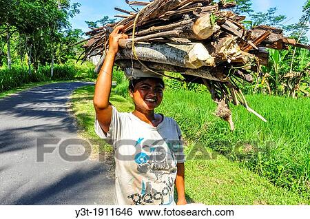 Asia, South-East Asia, Indonesia, Bali, Sidemen. Woman working in timber transport. View Large Photo Image Stock Photograph - Asia, South-East Asia, Indonesia, Bali, Sidemen. Woman working in timber transport.. Fotosearch