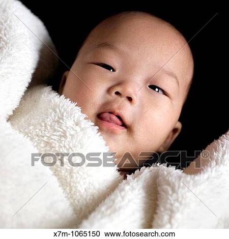 Asian baby boy covered by blanket View Large Photo Image Stock Image - Asian baby boy covered by blanket. Fotosearch