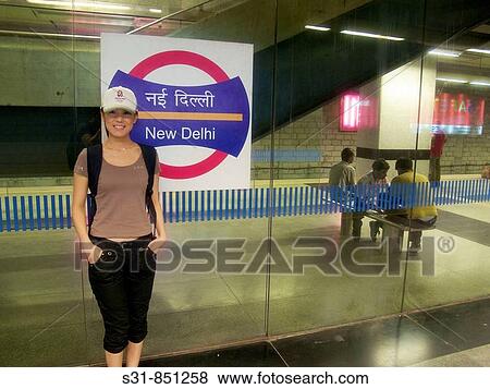 Asian chinese woman waiting for the subway in New Delhi India View Large Photo Image Stock Photo - Asian chinese woman waiting for the subway in New Delhi India. Fotosearch