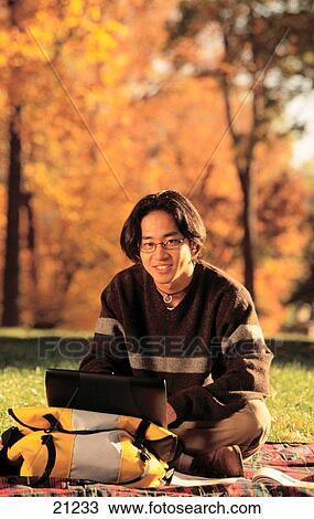 Asian college student with laptop computer View Large Photo Image Stock Image - Asian college student with laptop computer. Fotosearch