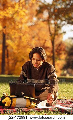 Asian college student with laptop computer View Large Photo Image Stock Image - Asian college student with laptop computer. Fotosearch