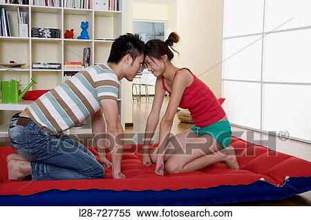 Asian Couple on the bed View Large Photo Image Stock Photography - Asian Couple on the bed. Fotosearch