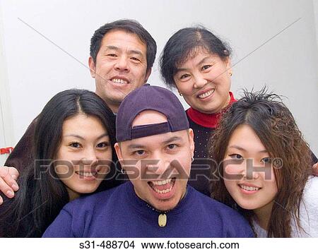 Asian family (chinese) father, mother and daughters View Large Photo Image Picture - Asian family (chinese) father, mother and daughters. Fotosearch