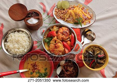 Stock Image - Asian food, fried stewed shark, vegetables, salad, soup, rice,.. Fotosearch