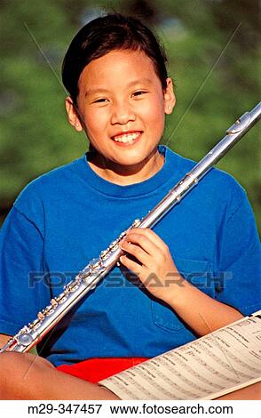 Stock Photo - Asian girl and flute. Fotosearch