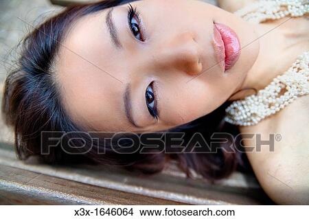 Picture - Asian girl face portrait. Fotosearch