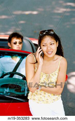 Asian girl on cellular View Large Photo Image Stock Image - Asian girl on cellular. Fotosearch