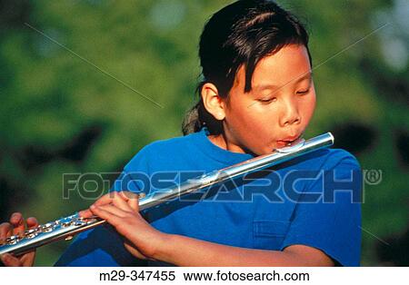 Asian girl playing flute View Large Photo Image Stock Photography - Asian girl playing flute. Fotosearch