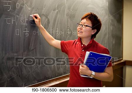 Asian graduate student at blackboard View Large Photo Image Stock Image - Asian graduate student at blackboard. Fotosearch