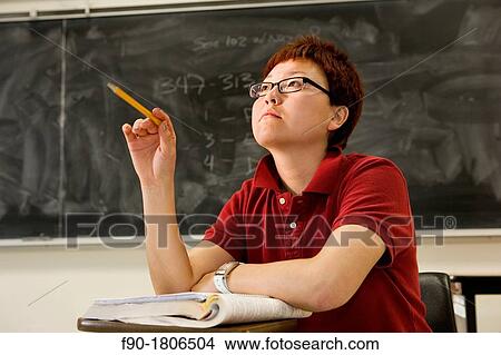 Asian graduate student in class View Large Photo Image Picture - Asian graduate student in class. Fotosearch