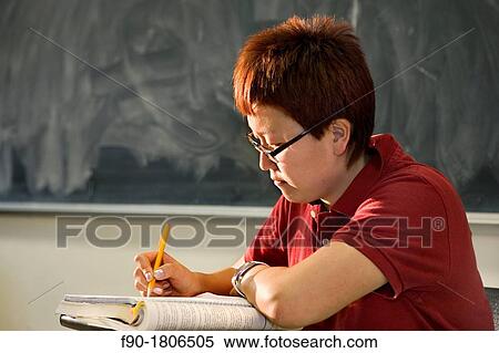 Asian graduate student in class View Large Photo Image Stock Photography - Asian graduate student in class. Fotosearch