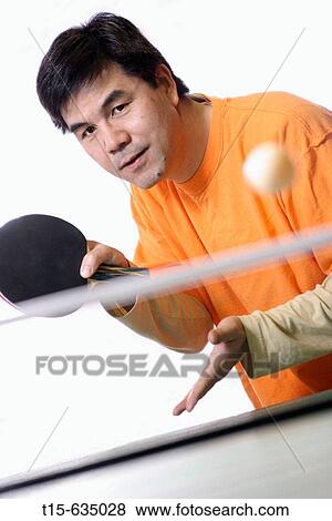 Asian man playing ping pong View Large Photo Image Stock Photo - Asian man playing ping pong. Fotosearch