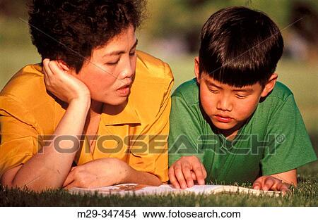 Asian mother and son reading View Large Photo Image Picture - Asian mother and son reading. Fotosearch