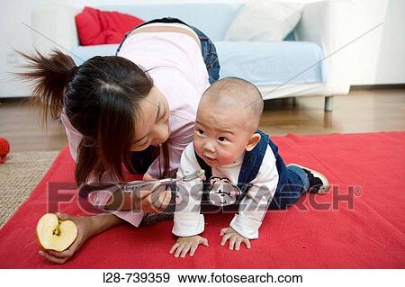 Asian mother With baby View Large Photo Image Stock Photo - Asian mother With baby. Fotosearch