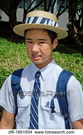 Asian school boy aged 13 in uniform in Sydney Australia in New South Wales View Large Photo Image Picture - Asian school boy aged 13 in uniform in Sydney Australia in New South Wales. Fotosearch