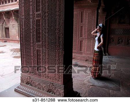 Asian woman in an Indian temple red fort in Agra View Large Photo Image Stock Photo - Asian woman in an Indian temple red fort in Agra. Fotosearch