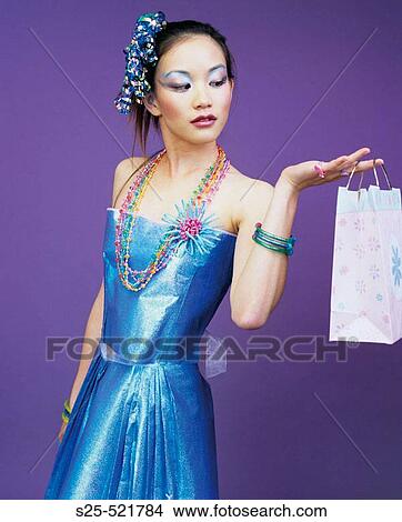 Asian Woman in Skirt & Top made from Wrapping Paper, MR #1056 View Large Photo Image Picture - Asian Woman in Skirt & Top made from Wrapping Paper, MR #1056. Fotosearch