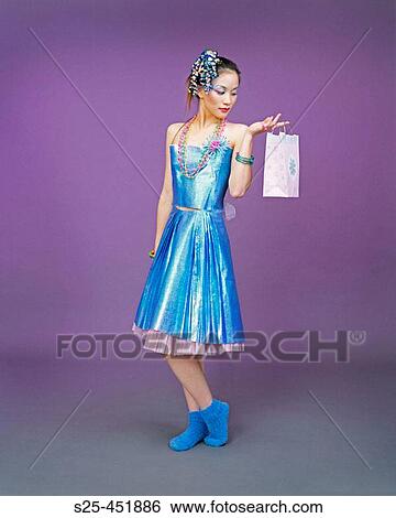 Asian Woman in Skirt & Top made from Wrapping Paper. View Large Photo Image Stock Photograph - Asian Woman in Skirt & Top made from Wrapping Paper.. Fotosearch