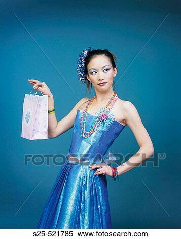 Stock Photography - Asian Woman in Skirt & Top made from Wrapping Paper, MR #1056. Fotosearch