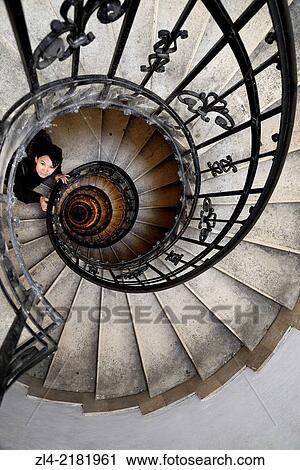 Asian woman in the spiral (helical) staircase in the tower of the Basilica of St Stephen. Hungary, Budapest, Pest, Belvaros. Model Released. View Large Photo Image Stock Image - Asian woman in the spiral (helical) staircase in the tower of the Basilica of St Stephen. Hungary, Budapest, Pest, Belvaros. Model Released.. Fotosearch