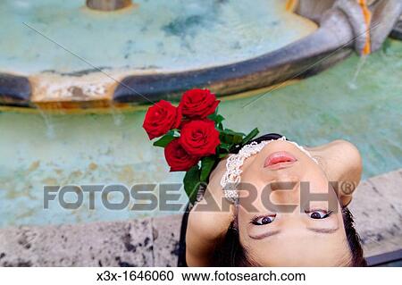 Stock Image - Asian woman posing water fountain Piazza di Spagna Rome Italy. Fotosearch