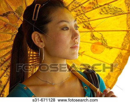 Asian woman under umbrella, Bangkok, Thailand. View Large Photo Image Stock Photo - Asian woman under umbrella, Bangkok, Thailand.. Fotosearch